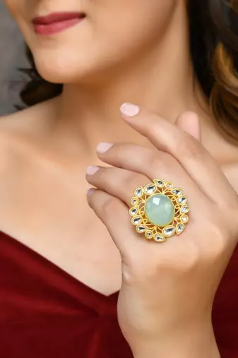 Floral kundan green stone ring
