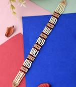 Gold plated red stone studded pearl beaded matha patti