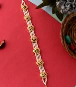 Gold plated pearl beaded & green stone studded matha patti