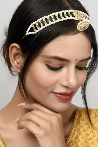 Gold plated kundan & green stone studded matha patti
