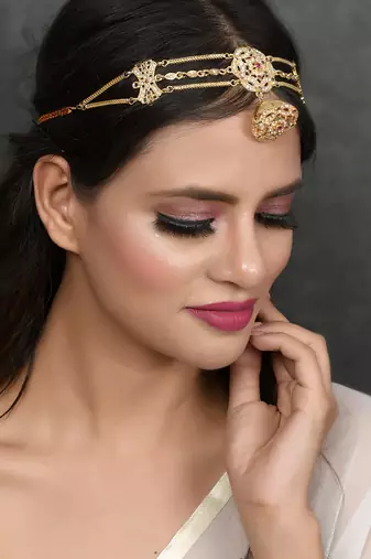 Gold plated pink cubic zirconia stone studded handcrafted head chain with borla