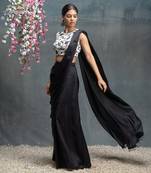 Ivory and black predraped saree with blouse.