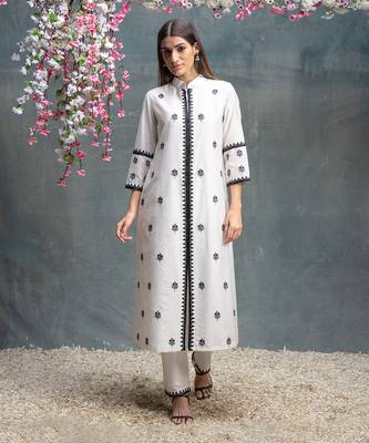 Ivory and black kurta pant set. 1