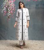 Ivory and black kurta pant set.