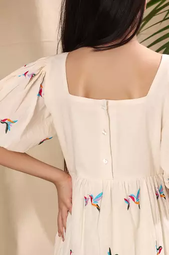 Off white embroidered empire line dress