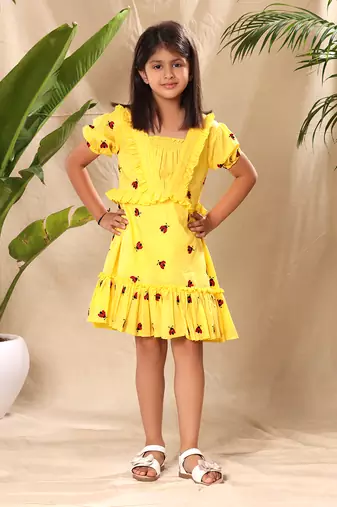 Yellow embroidered fit and flared tier dress with puff sleeves