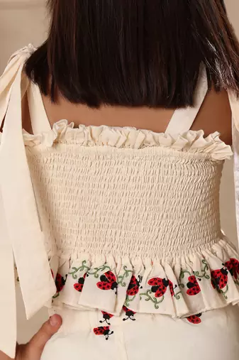 Off white embroidered smocked top and pant co-ord set