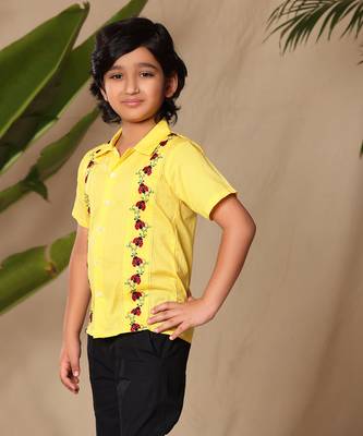 Yellow embroidered shirt with black trousers 3