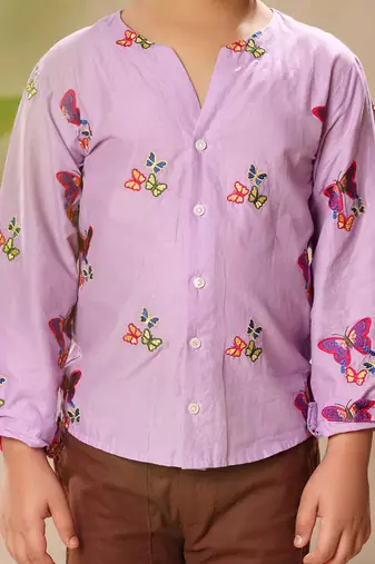 Lavender embroidered no collar shirt with brown trousers