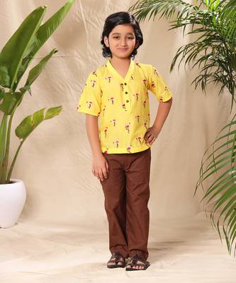 Yellow embroidered no collar short kurta with brown trousers 1