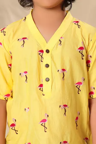 Yellow embroidered no collar short kurta with brown trousers