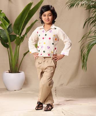 Off white embroidered classic shirt with beige trousers 1