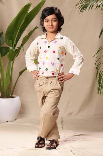 Off white embroidered classic shirt with beige trousers