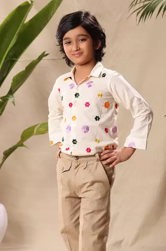 Off white embroidered classic shirt with beige trousers