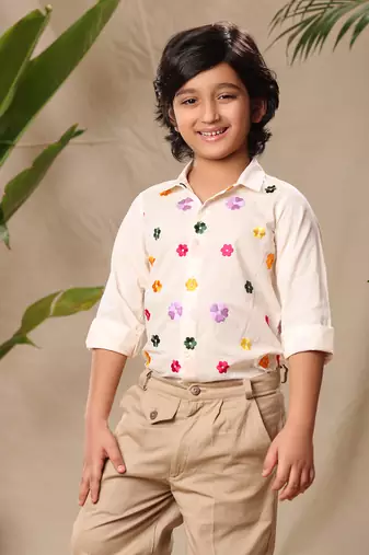 Off white embroidered classic shirt with beige trousers