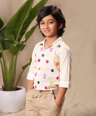 Off white embroidered classic shirt with beige trousers 4