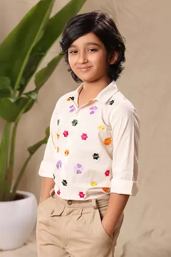 Off white embroidered classic shirt with beige trousers
