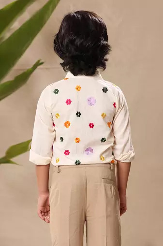 Off white embroidered classic shirt with beige trousers