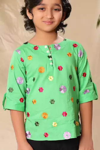 Green embroidered kurta shirt with black trousers
