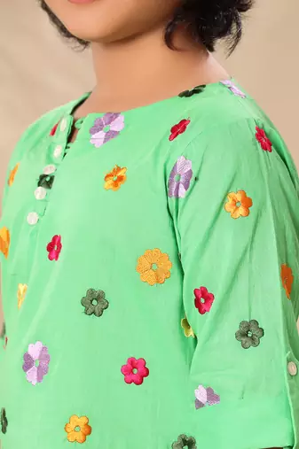 Green embroidered kurta shirt with black trousers