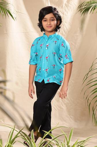 Blue embroidered raglan sleeves shirt with black trousers