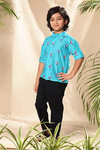 Blue embroidered raglan sleeves shirt with black trousers