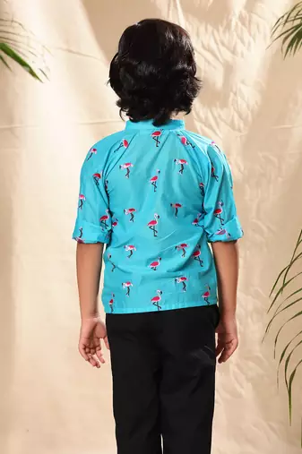 Blue embroidered raglan sleeves shirt with black trousers
