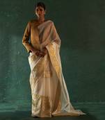 Ivory saree with tissue blouse & gold blazer