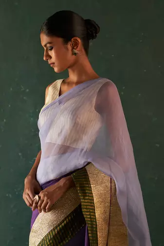 Purple saree with sleeveless blouse