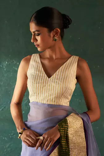 Purple saree with sleeveless blouse
