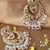 Gold Plated Earrings with Red Stone and Kundan Embellishments