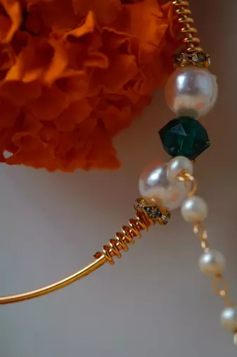 Traditional Gold Nose Ring with White Pearl Chain for Festive and Bridal Elegance