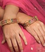Traditional Red and Green Stone Studded Gold Laxmi Motif Bangles - Set of 2