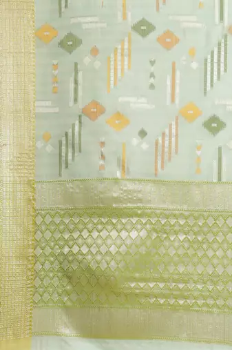 Green woven tissue saree with blouse