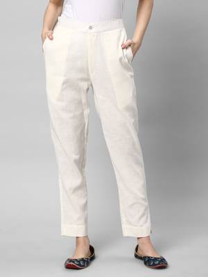 A off-white ankle length coton linen pant with plain belt in front. 1