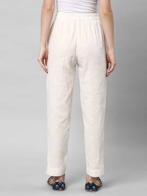 A off-white ankle length coton linen pant with plain belt in front. 2