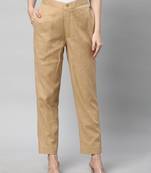 A beige ankle length coton linen pant with plain belt in front.