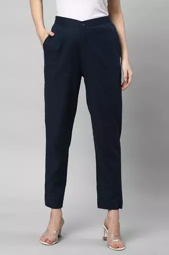 A blue ankle length coton linen pant with plain belt in front.