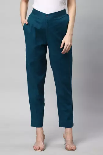 A teal ankle length coton linen pant with plain belt in front.