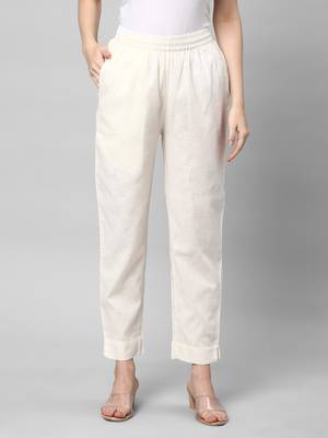 A fully elasticated off-white ankle length cotton linen pant. 1