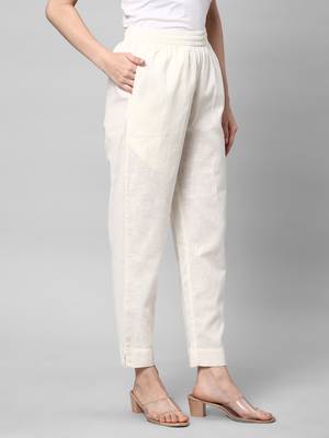 A fully elasticated off-white ankle length cotton linen pant. 3