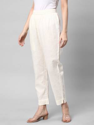 A fully elasticated off-white ankle length cotton linen pant. 4