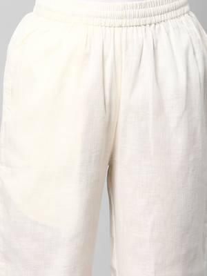 A fully elasticated off-white ankle length cotton linen pant. 5