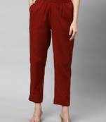 A fully elasticated rust ankle length cotton linen pant.