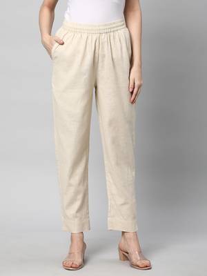 A fully elasticated cream ankle length cotton linen pant. 1