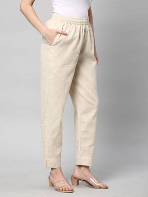 A fully elasticated cream ankle length cotton linen pant. 3