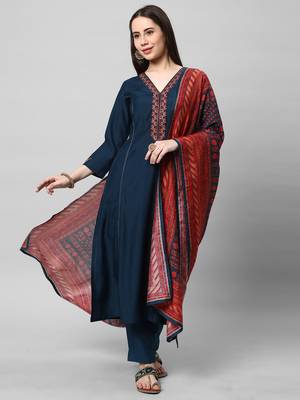 A machine embroidered kurta with self bottom paired with printed dupatta. 1