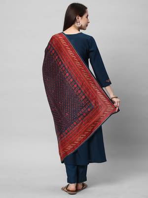 A machine embroidered kurta with self bottom paired with printed dupatta. 2
