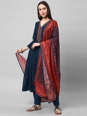 A machine embroidered kurta with self bottom paired with printed dupatta. 3