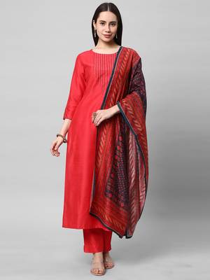 A straight kurta set with machine embroidery embellished with cut work. 1